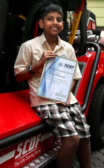 Boy, 12, who helped accident victims, gets SCDF award
