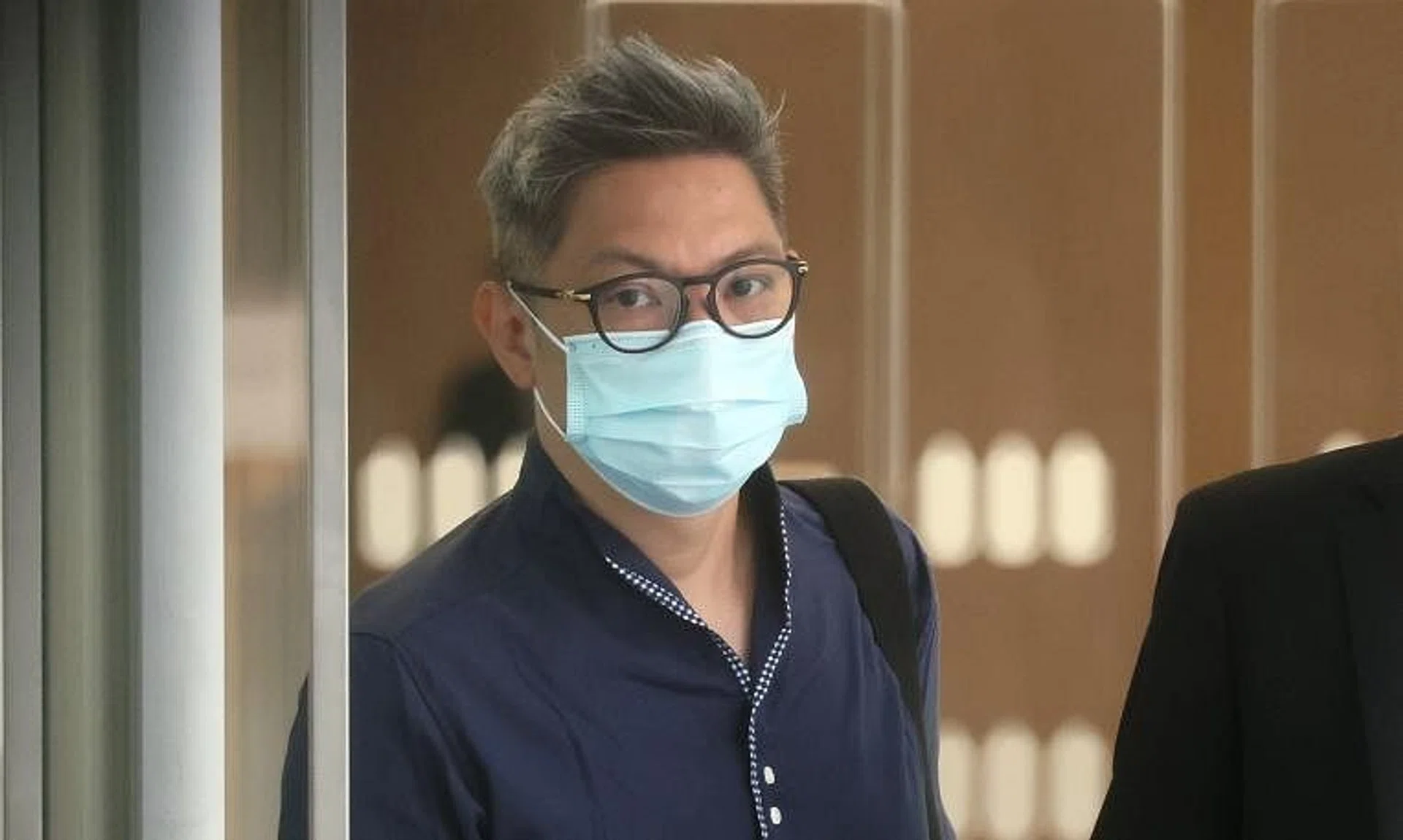 Adrian Chan Siew Leng is said to have committed the offences in exchange for advancing the business interest of the companies with NLB.