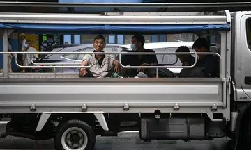 Migrant worker groups urge Government for timeline to stop transporting workers in lorries