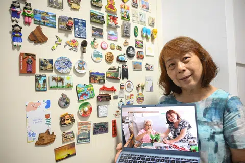 Ms Florence Chuah with a picture of her elder sister, Ms Flora Chuah. She cared for two of her sisters, as both were in palliative care by end-2024.