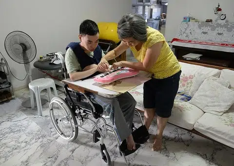 Mum of special-needs son sings to him every day