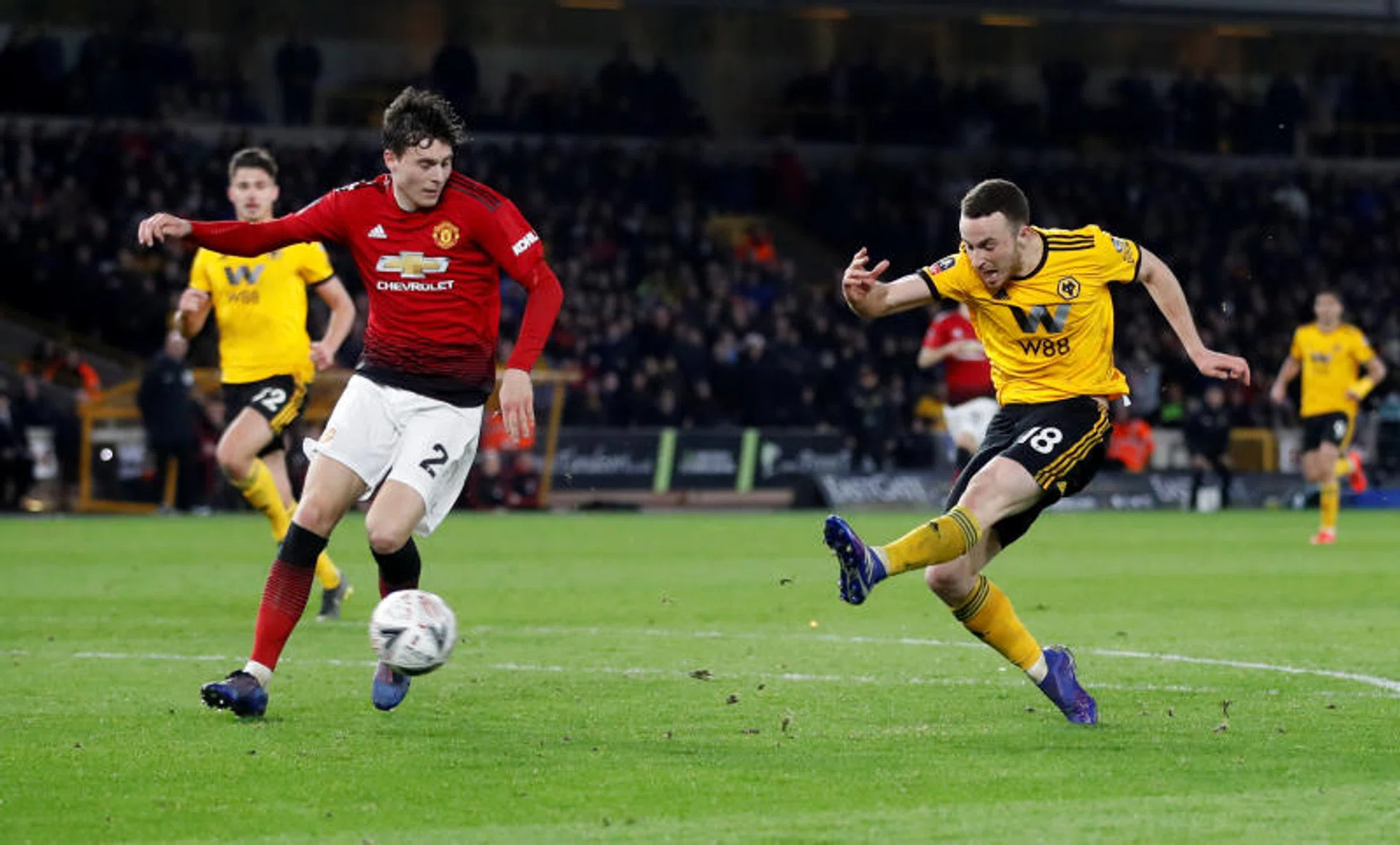 Diogo Jota (right) scoring Wolves' second goal.
