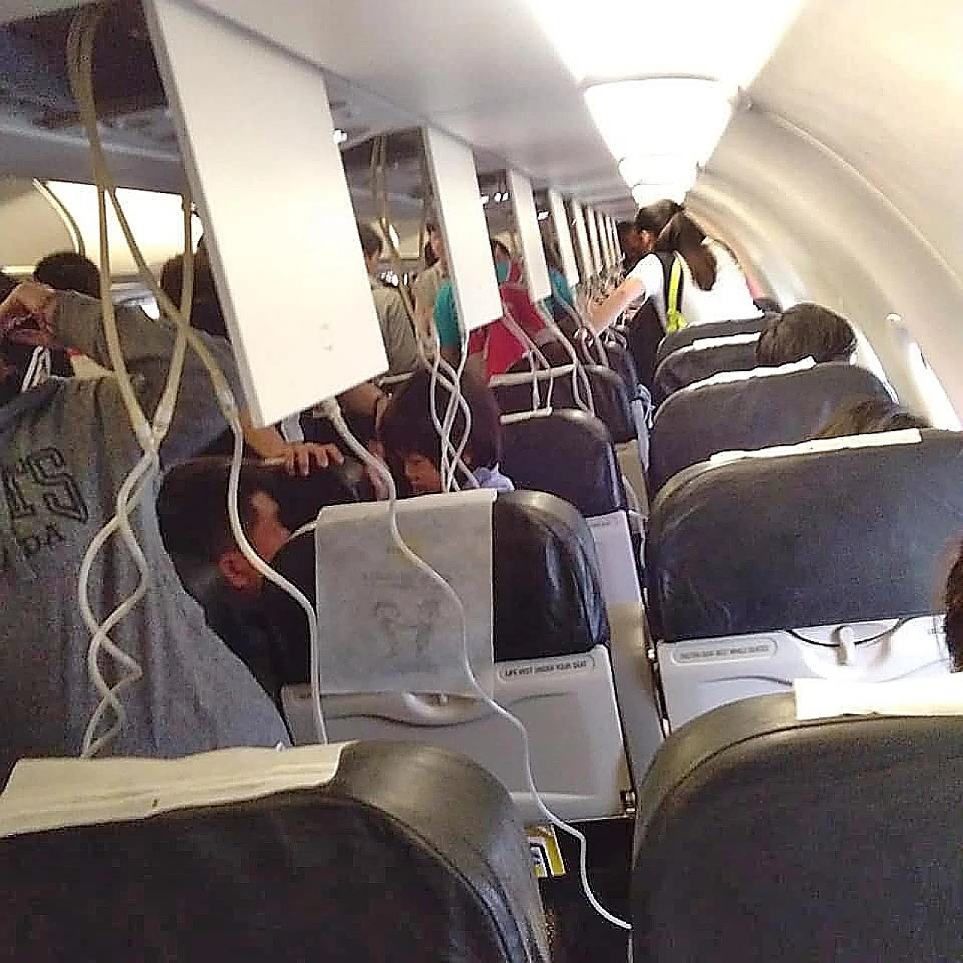 One passenger said there was a smell of "burnt wiring" when the oxygen masks were deployed.