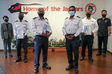 Security officers get awards for saving colleague's life