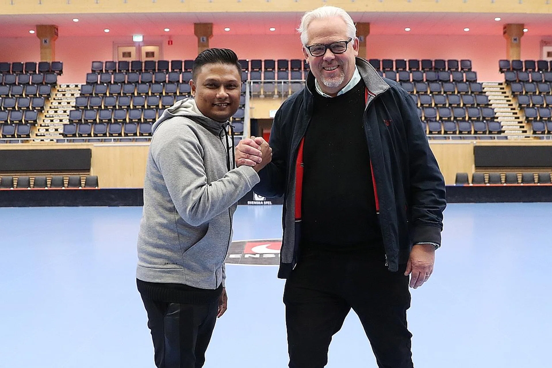 Youth Floorball Academy CEO Norani Zaini (left) with Storvreta president Ingemar Lundqvist, after agreeing on a deal. 