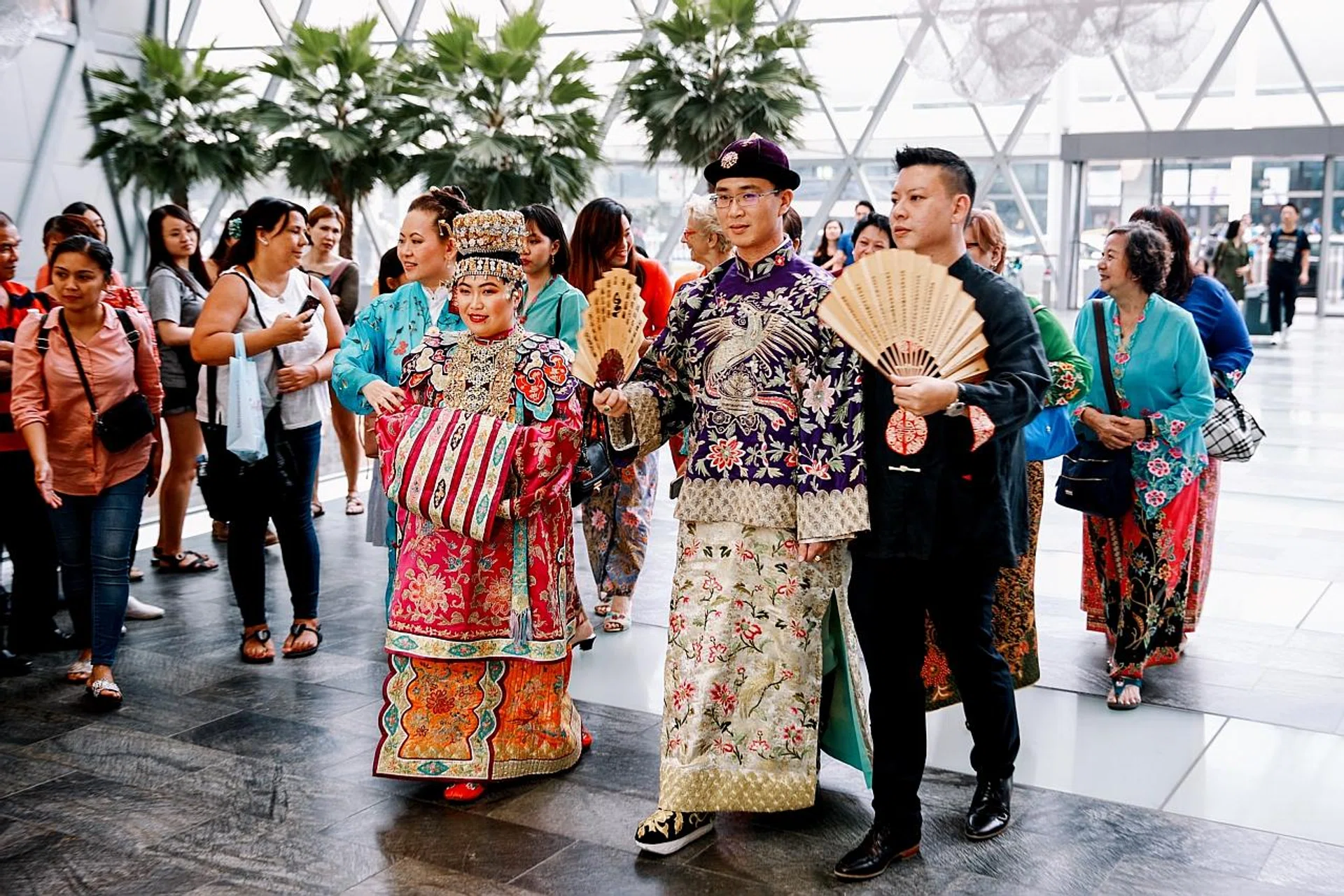 Mr Huang Wen and his wife Laurie in their traditional Peranakan wedding outfits. 