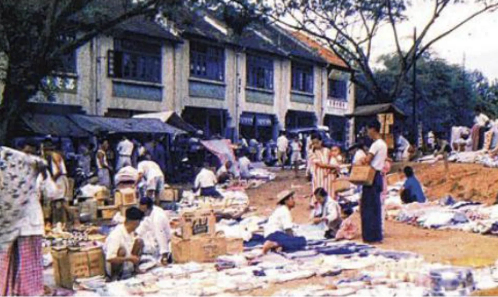 Vendors hawking their wares at the Holland Village of the past.