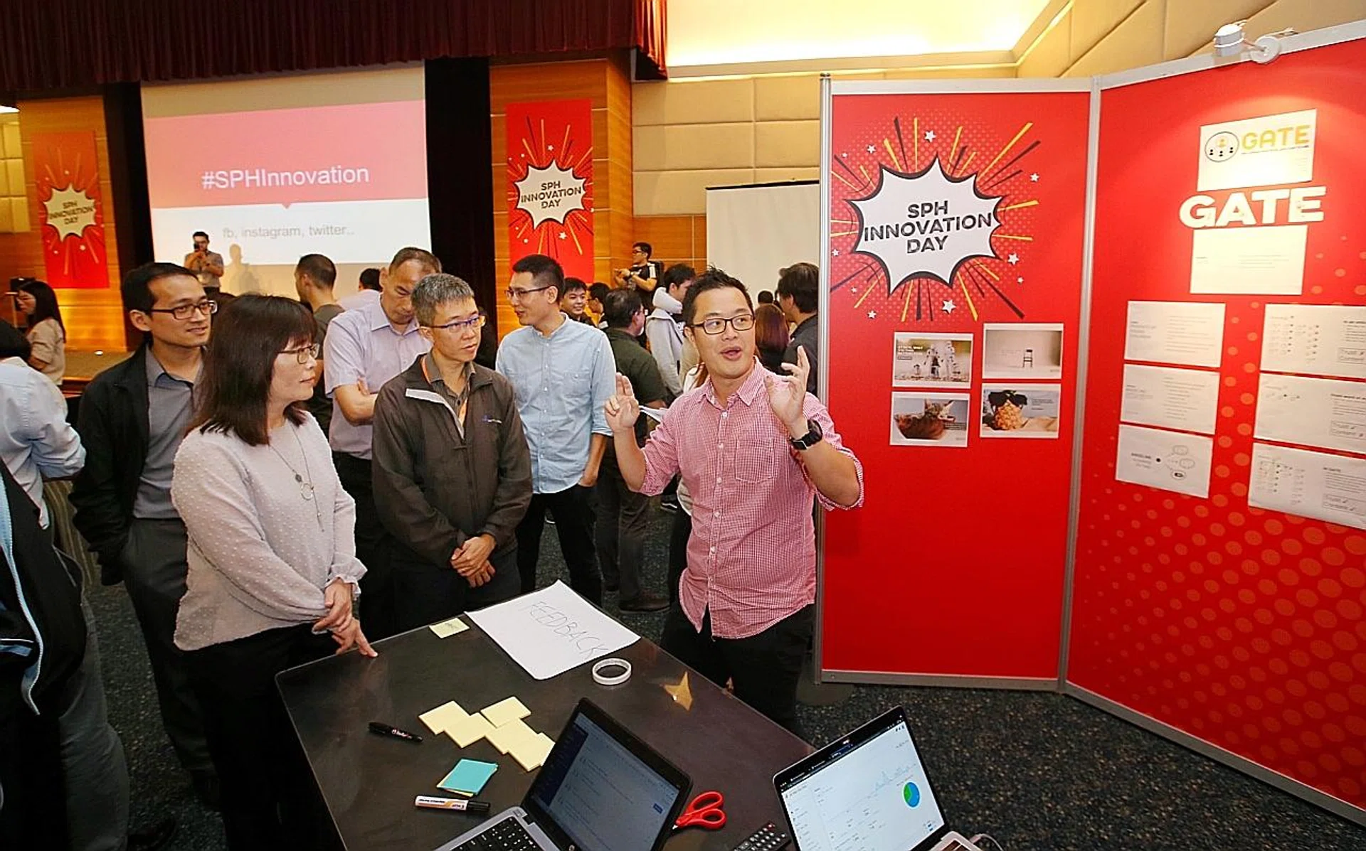 Straits Times journalist Aw Cheng Wei explaining his team's project "Gate". 