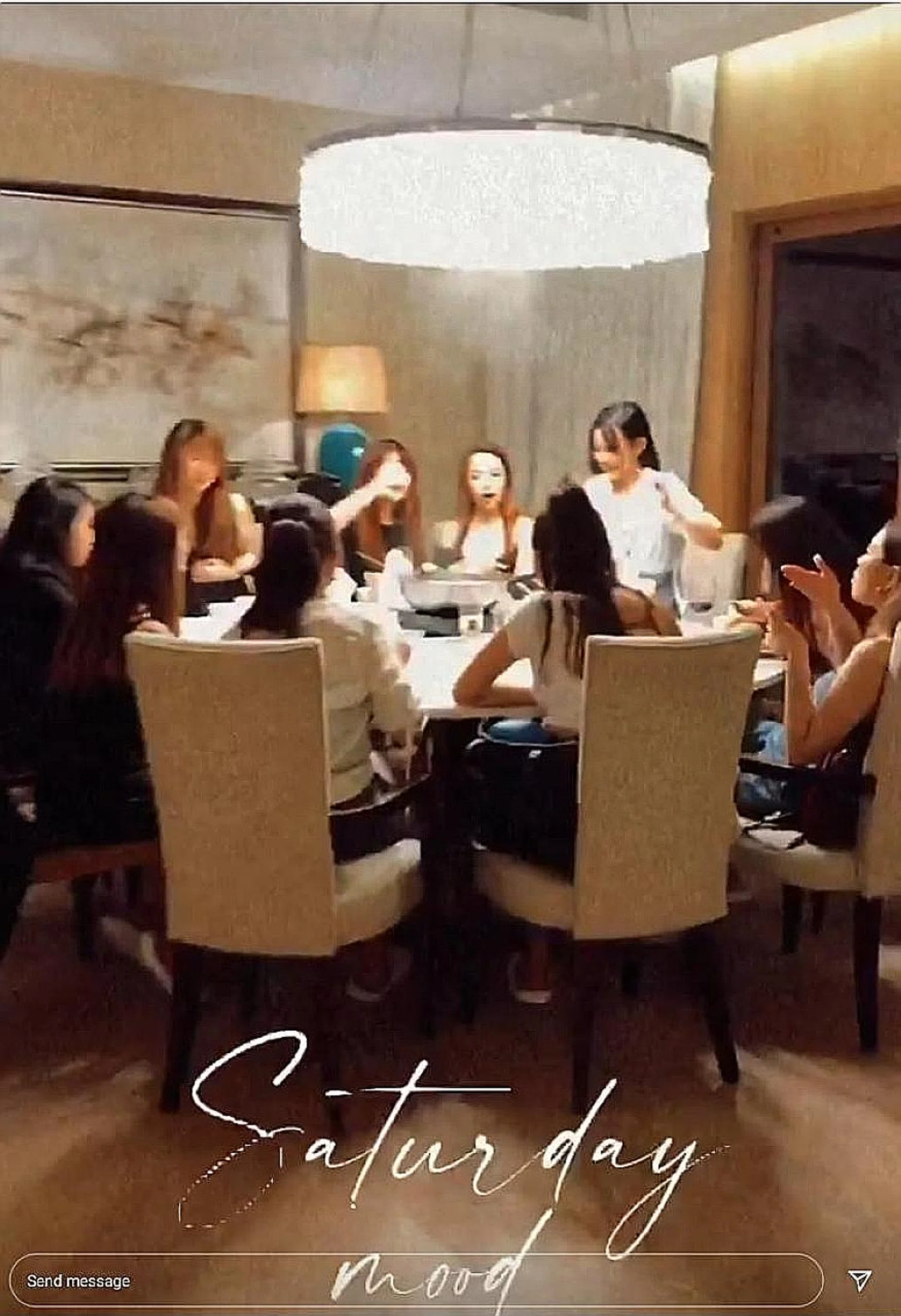 A group of at least 10 people are seen dining in a hotel suite. A video allegedly shows the group entering the hotel together.