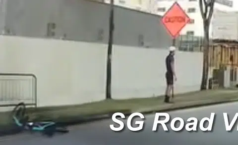 Cyclist almost crushed by bus after skidding on wet road