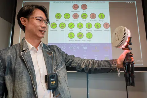 Mr Choong Kit Soon, pre-sales lead of Motorola Solutions Singapore, holding a Halo Smart Sensor at their office in 2024.