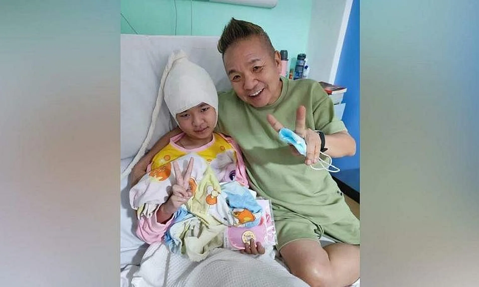 Local artiste Marcus Chin and his daughter Elise.
