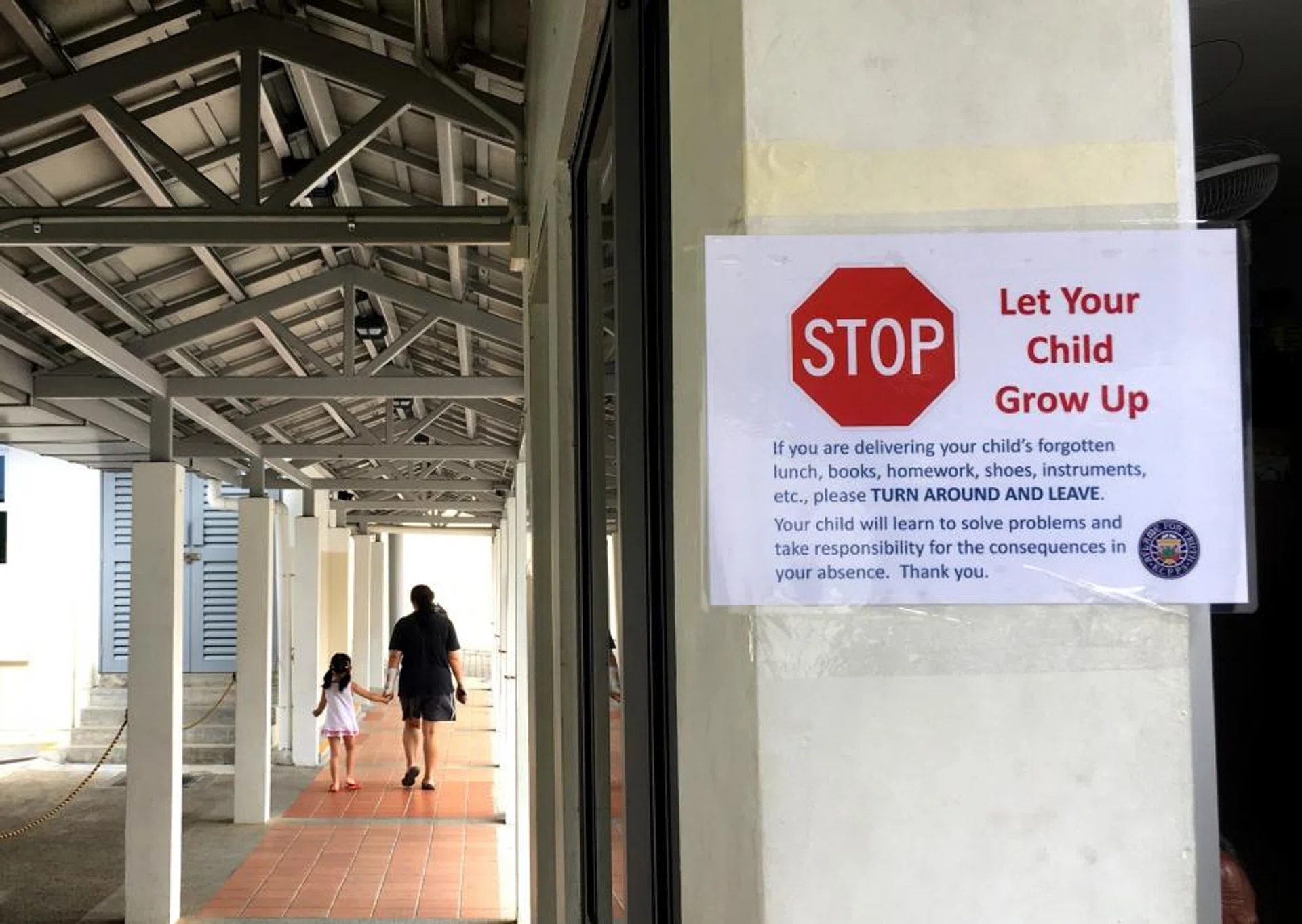 Signs are put up at Kuo Chuan Presbyterian Primary School, telling parents to “turn around and leave” if they are delivering forgotten items for their children. 