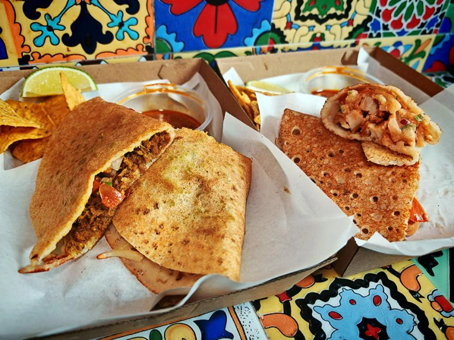 Lamb Rendang With Cheese Dosa Taco and Crispy Chicken With Podi Yoghurt Dosa Taco.