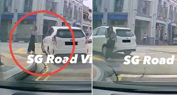 Car hits woman taking photo on road in Tanjong Pagar