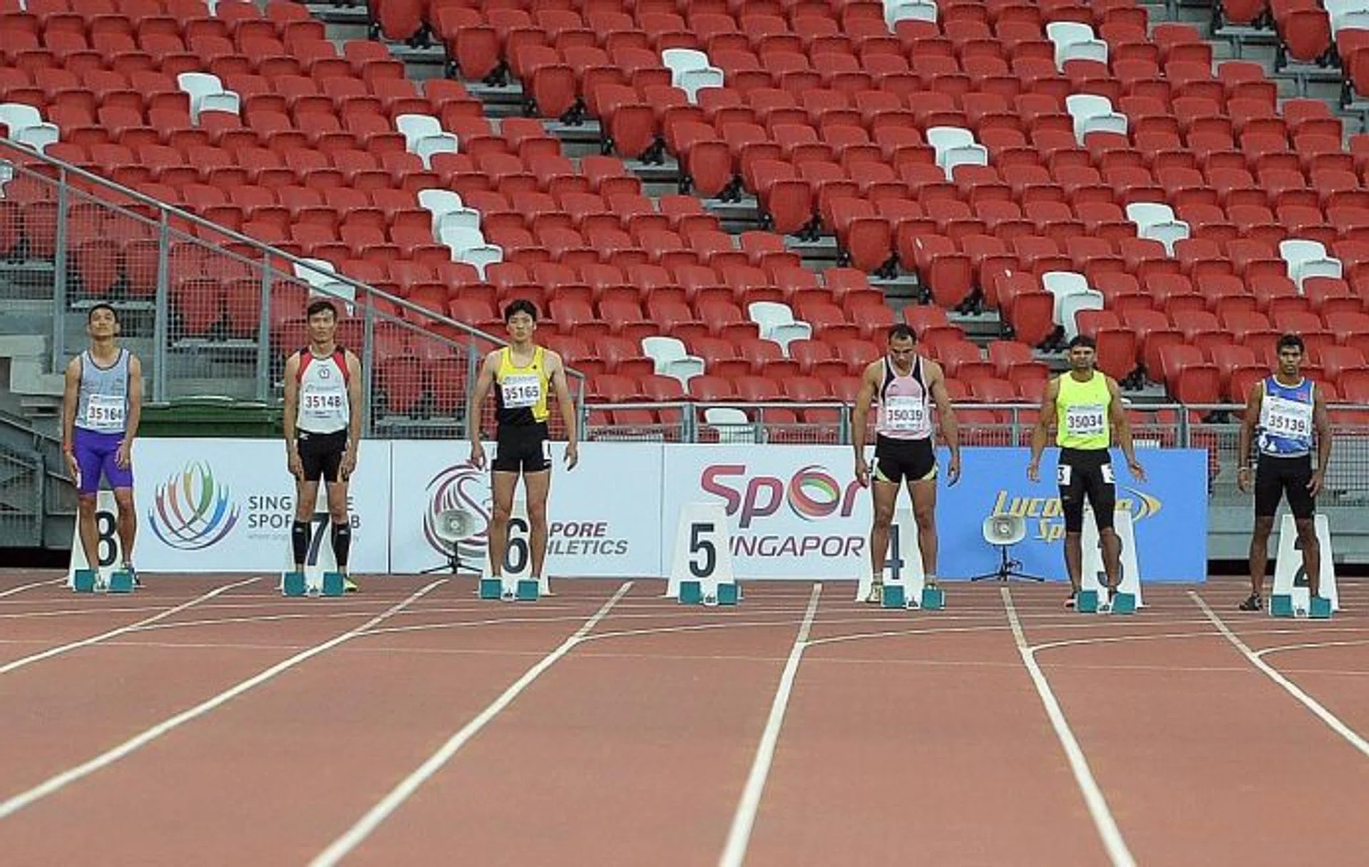 EMPTY: Lane 5 of the men's 100m (35-39 age group) is empty after Singapore's UK Shyam withdrew at the last minute. The race was won by Sri Lanka's WBY Rohana (far right).