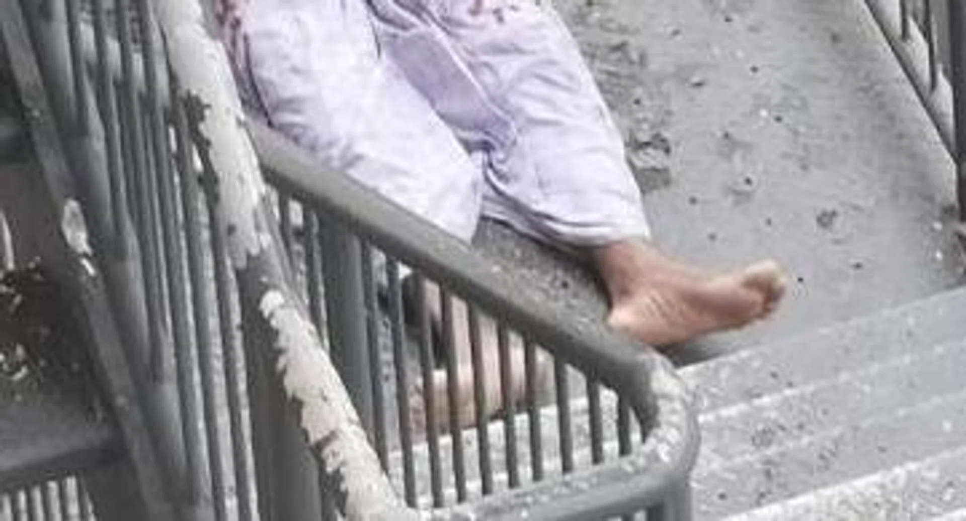 The man was seen lying bloodied at a staircase landing in the dorm. 