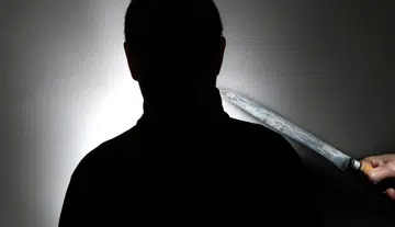 He put knife on patron's neck