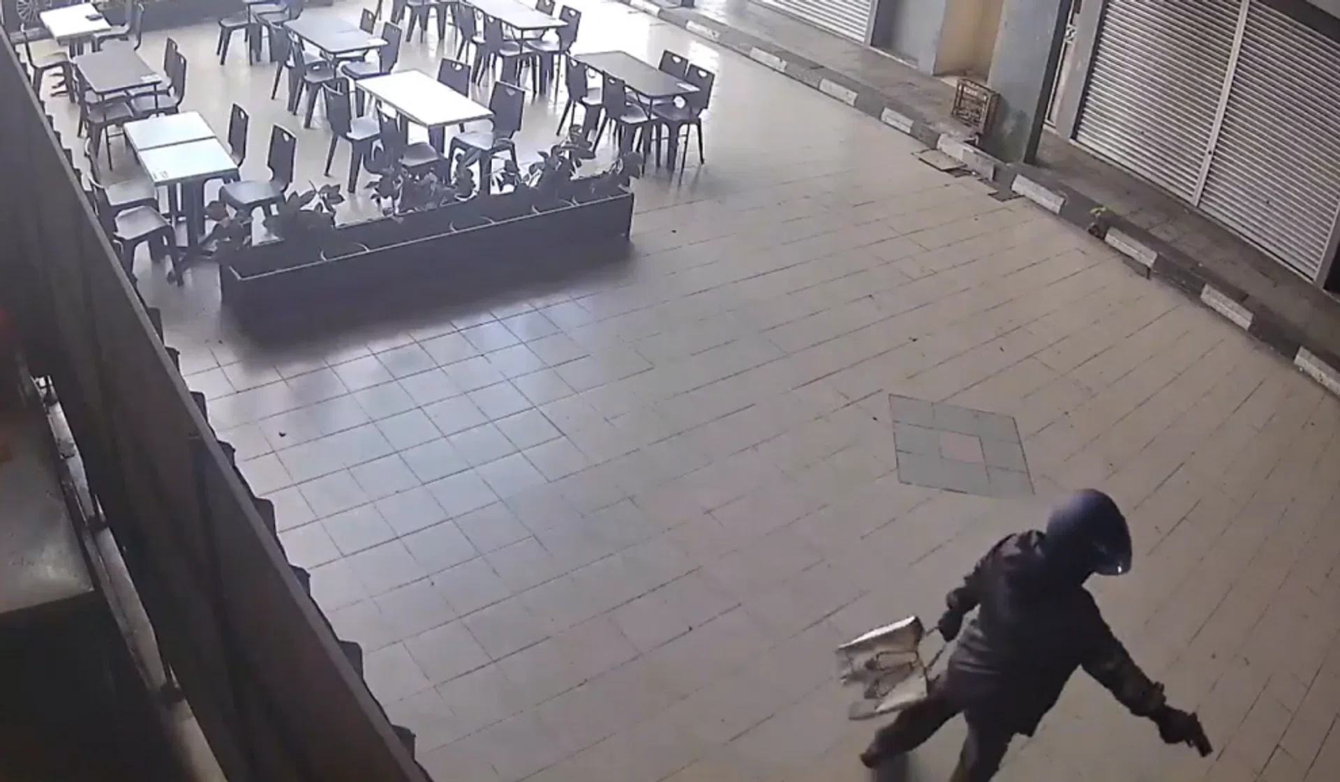 The man in helmet fired several shots before fleeing.