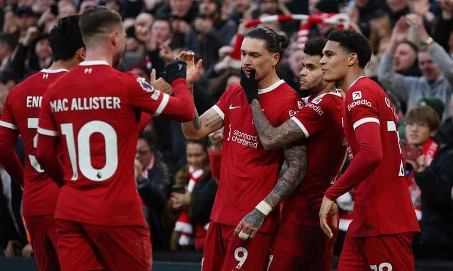 Soccer Football - Premier League - Liverpool v Burnley - Anfield, Liverpool, Britain - February 10, 2024 Liverpool's Darwin Nunez celebrates scoring their third goal with Jarell Quansah and Luis Diaz REUTERS/Phil Noble