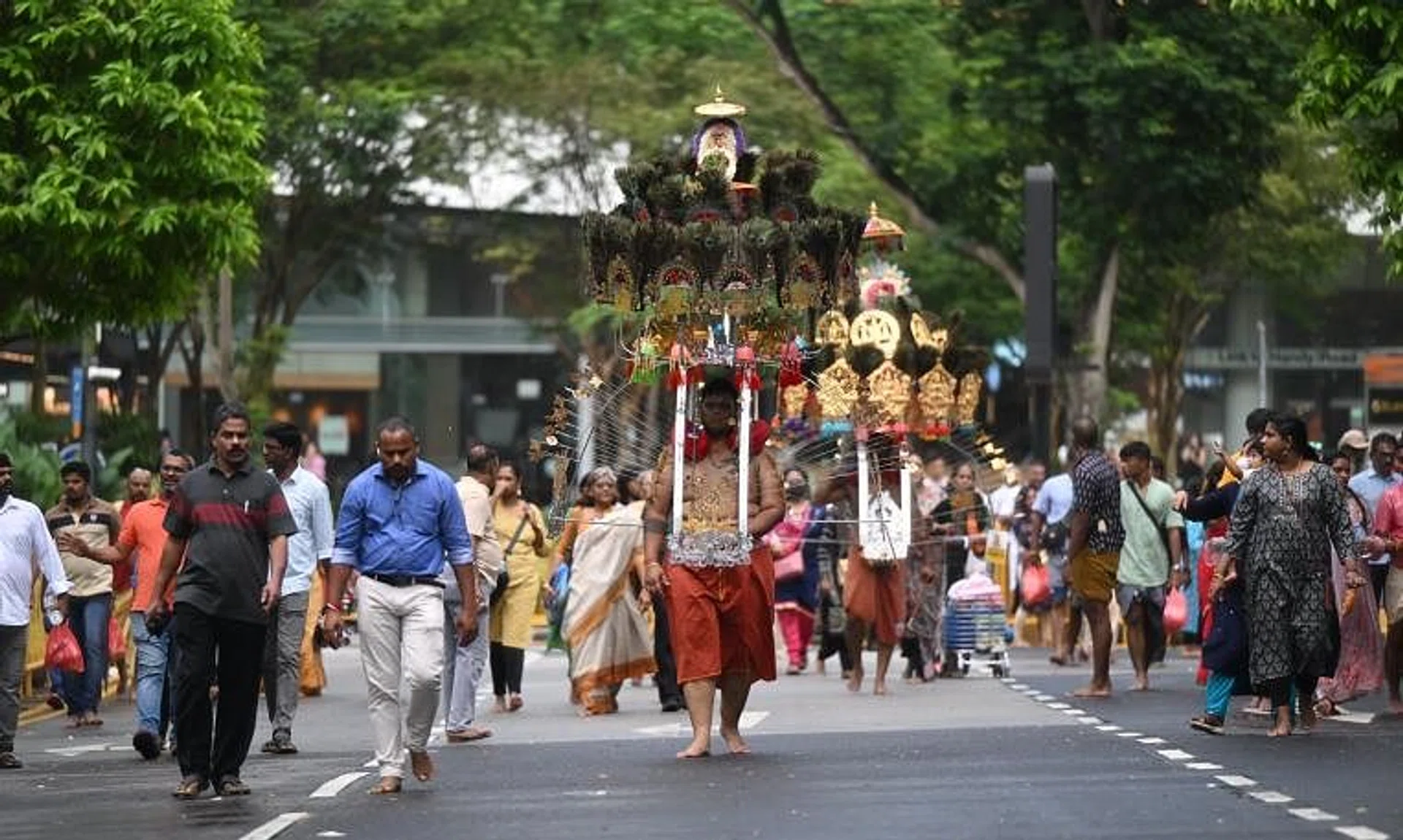 The devotees performing penitential acts on their walk of faith for Hindu god Lord Murugan.