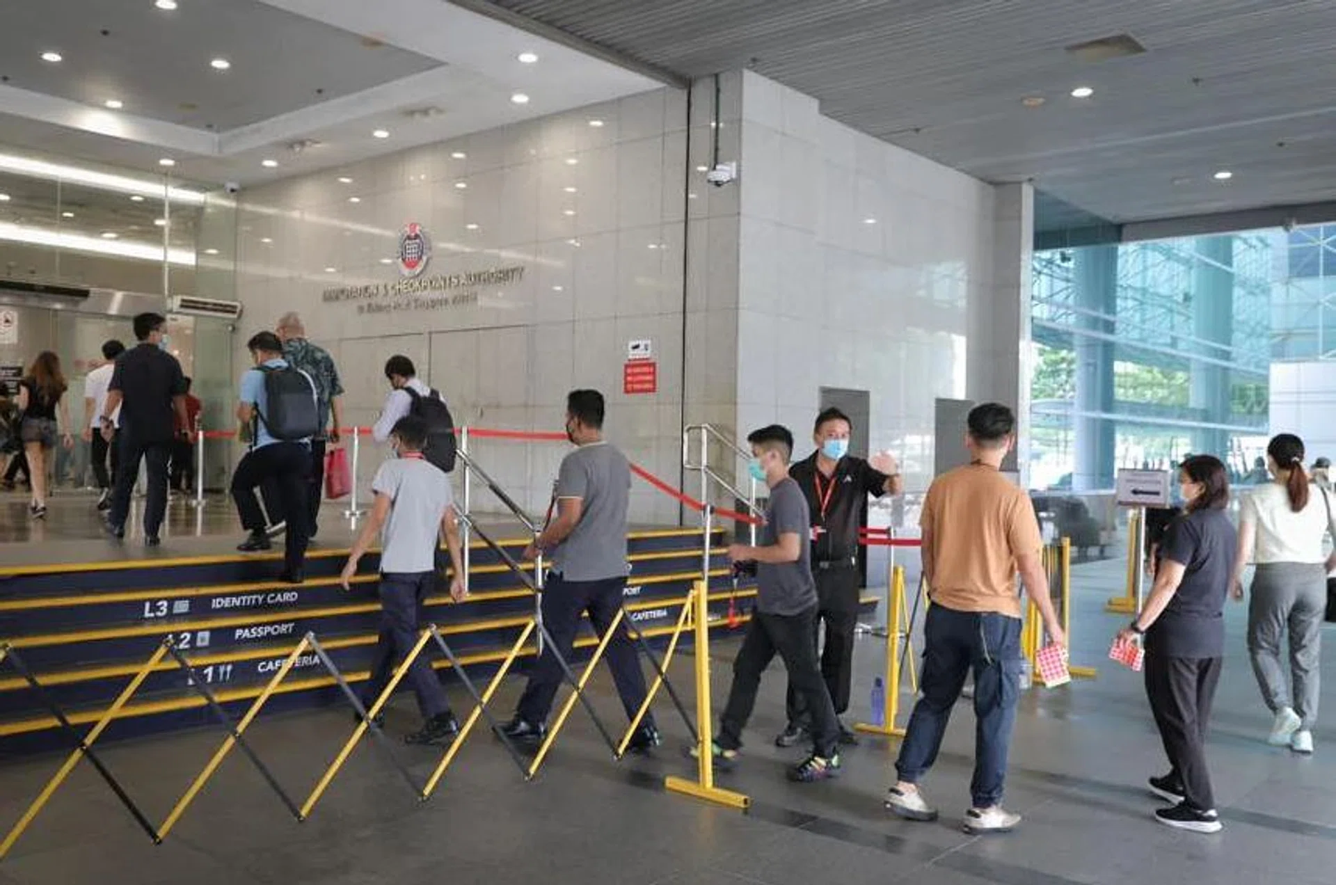 People entering the ICA building on May 11, 2022. ST PHOTO: ONG WEE JIN