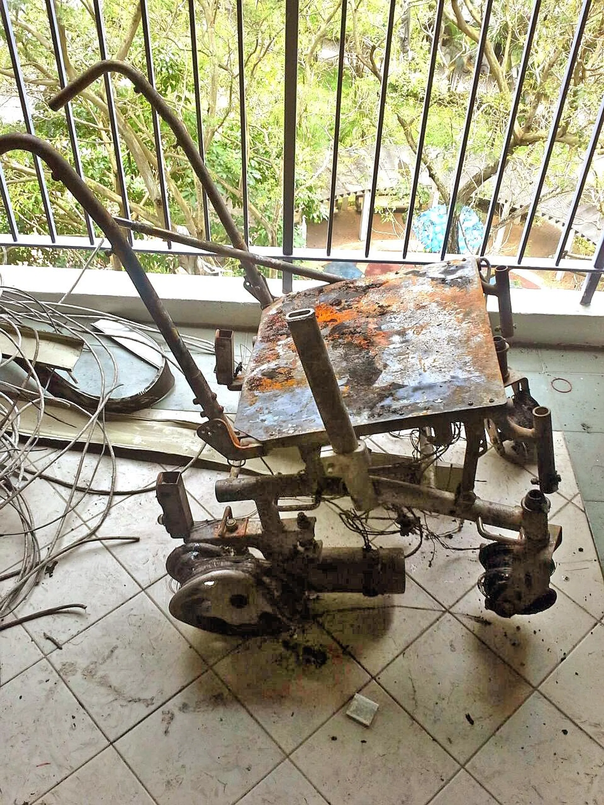 The fire caused extensive damage to the items along the corridor of the flat, including the motorised wheelchair (above). 