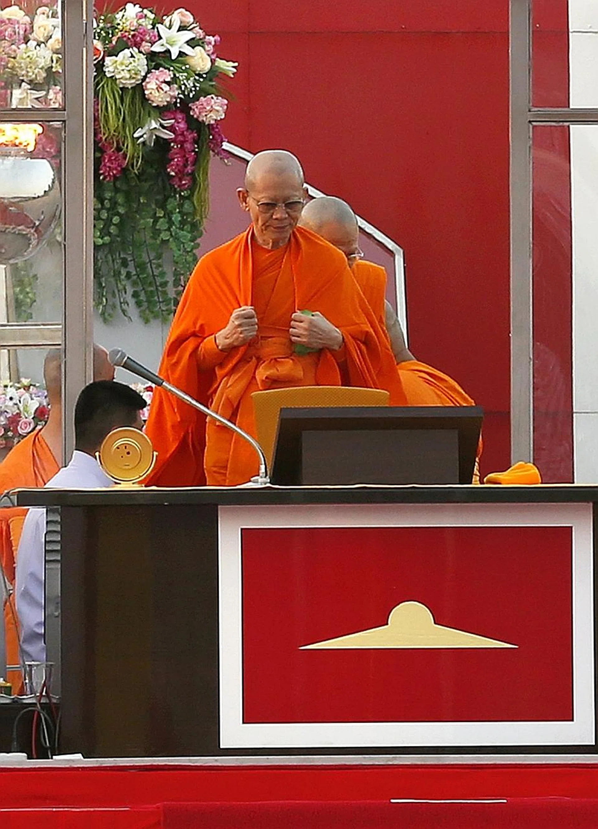 Phra Dhammachayo is wanted for embezzlement. 