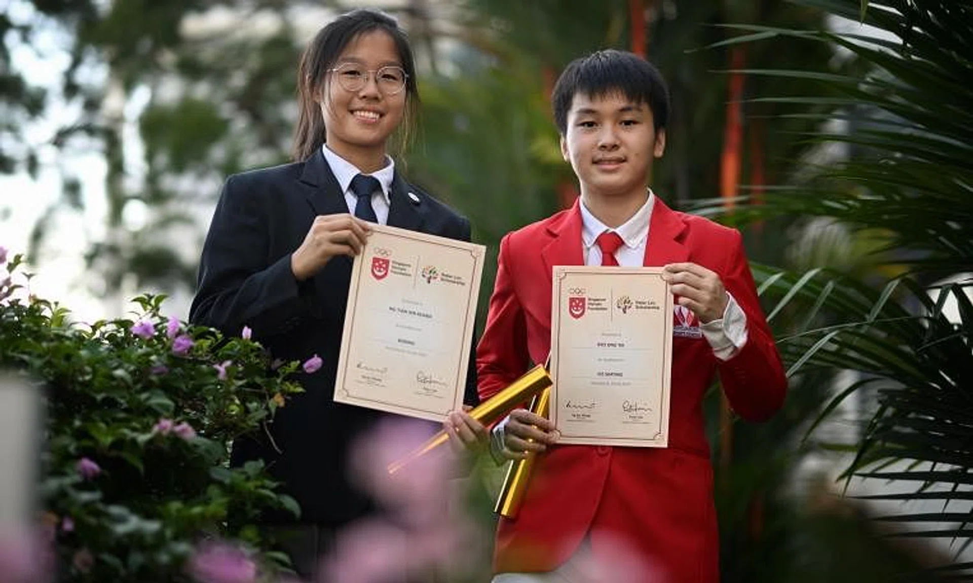 Boxer Keana Ng and Ice Skater Ryo Ong were recipients of the Singapore Olympic Foundation - Peter Lim Scholarship on Monday.

ST PHOTO: CHONG JUN LIANG