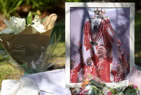 Flower tributes for Liverpool's Portuguese footballer Diogo Jota outside Anfield Stadium in Liverpool on July 3.