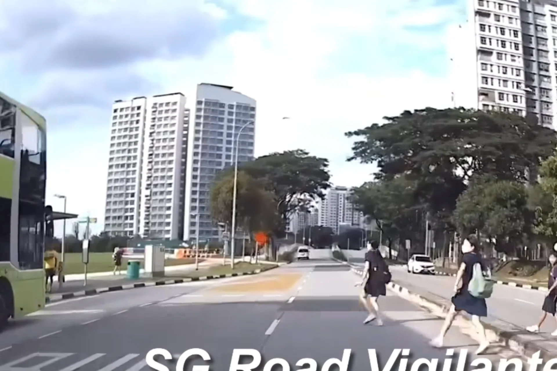 A group of students dashed across the road in a bid to catch the bus.
