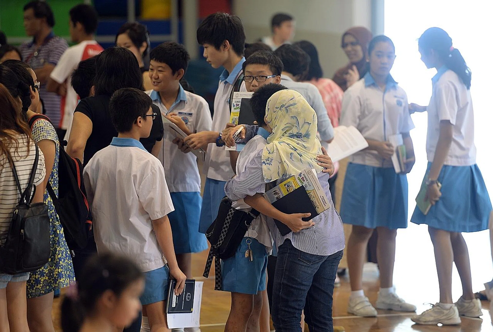 Pupils receiving their PSLE results. TNP FILE PHOTO