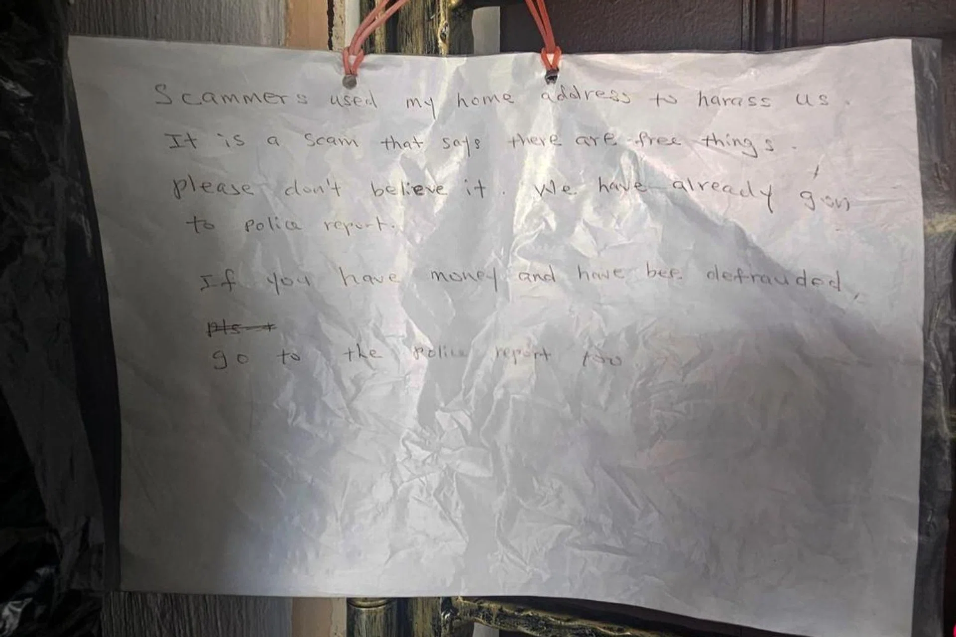 Mr Tan put up signs informing people that his address was used fraudulently.