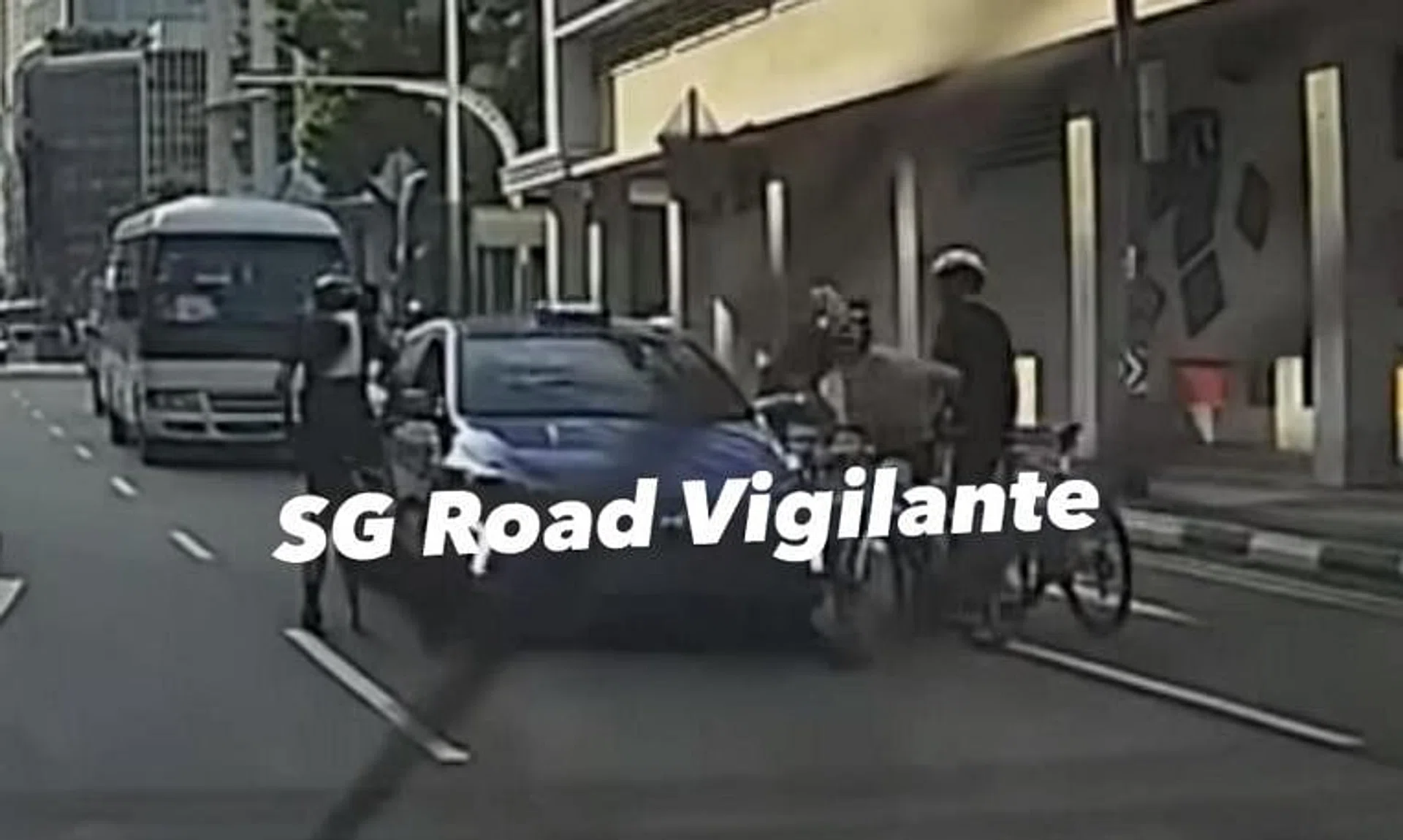 A video uploaded online showed the cyclists surrounding a taxi after the taxi stopped abruptly.
