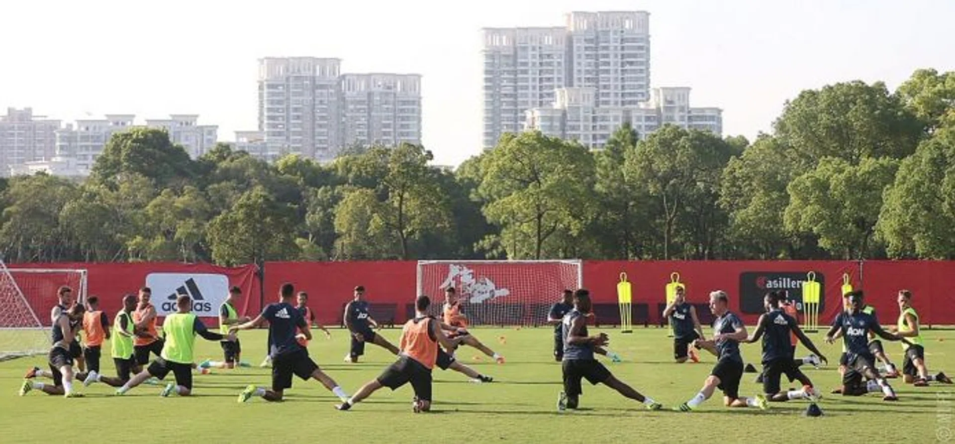 TRAINING: Manchester United players (above) being put through their paces in China, as they prepare for their friendly game against Borussia Dortmund tomorrow.  Jose Mourinho, though, is not expected to give Wayne Rooney a run-out.