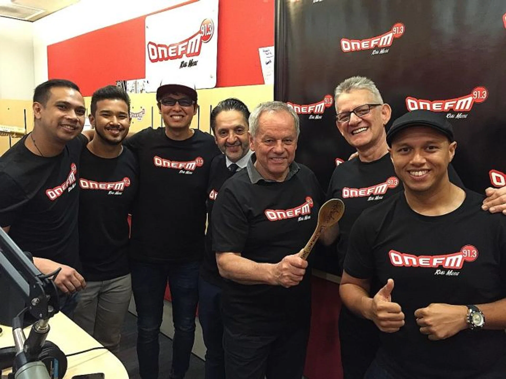 BONDING: Celebrity chef Wolfgang Puck (holding the spoon) with his business partner Alex Reznik and the ONE FM’s #1 Breakfast Show team.