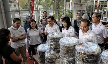 Low-income families get cookies, groceries and spruce-up for homes ahead of Hari Raya