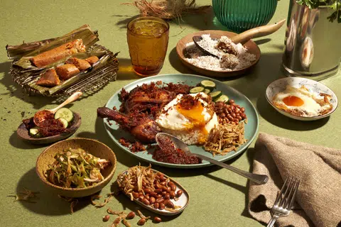 The Coconut Club's ayam goreng berempah nasi lemak spread.