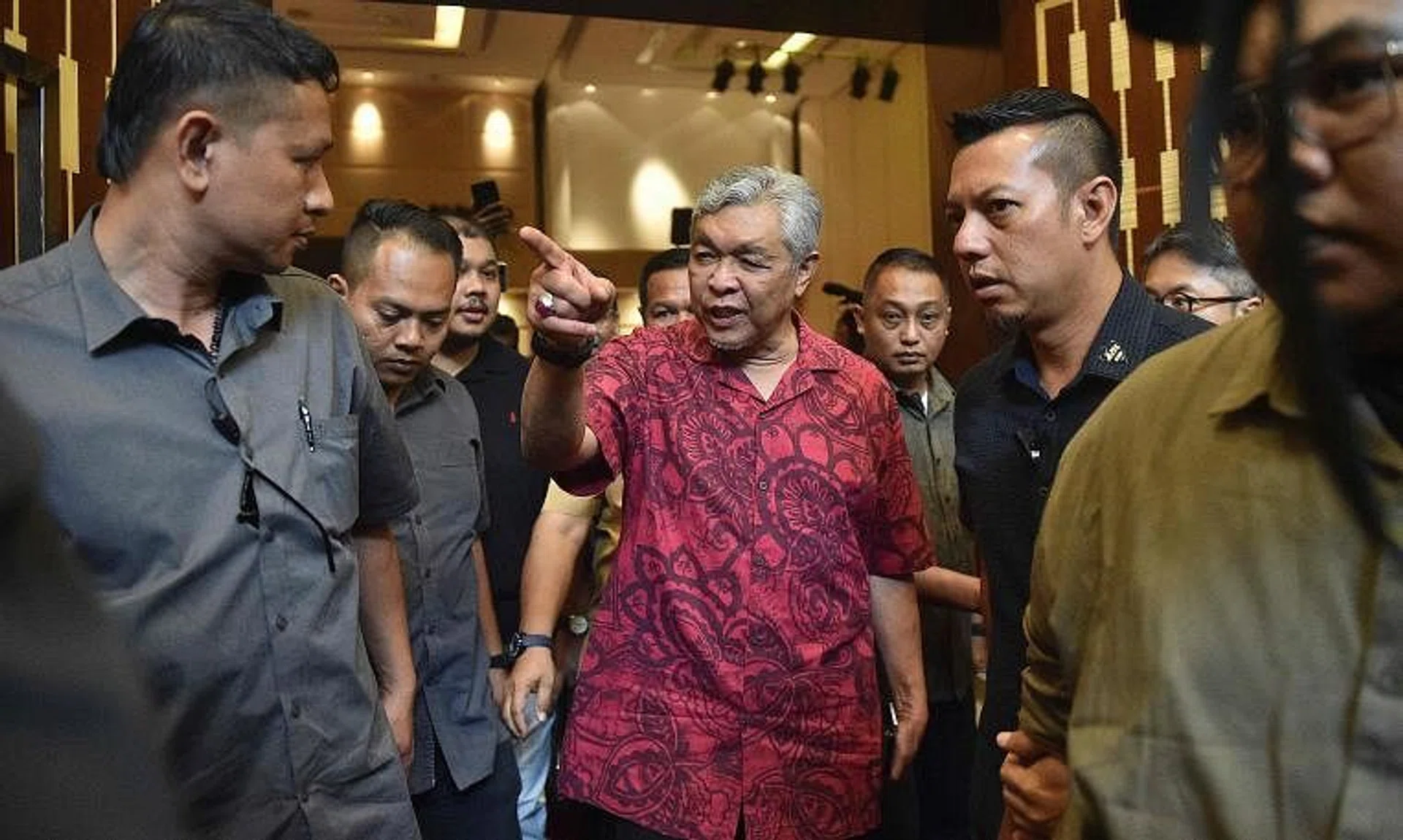 Umno president Zahid Hamidi leaves after a press conference in Kuala Lumpur, on Nov 21, 2022.