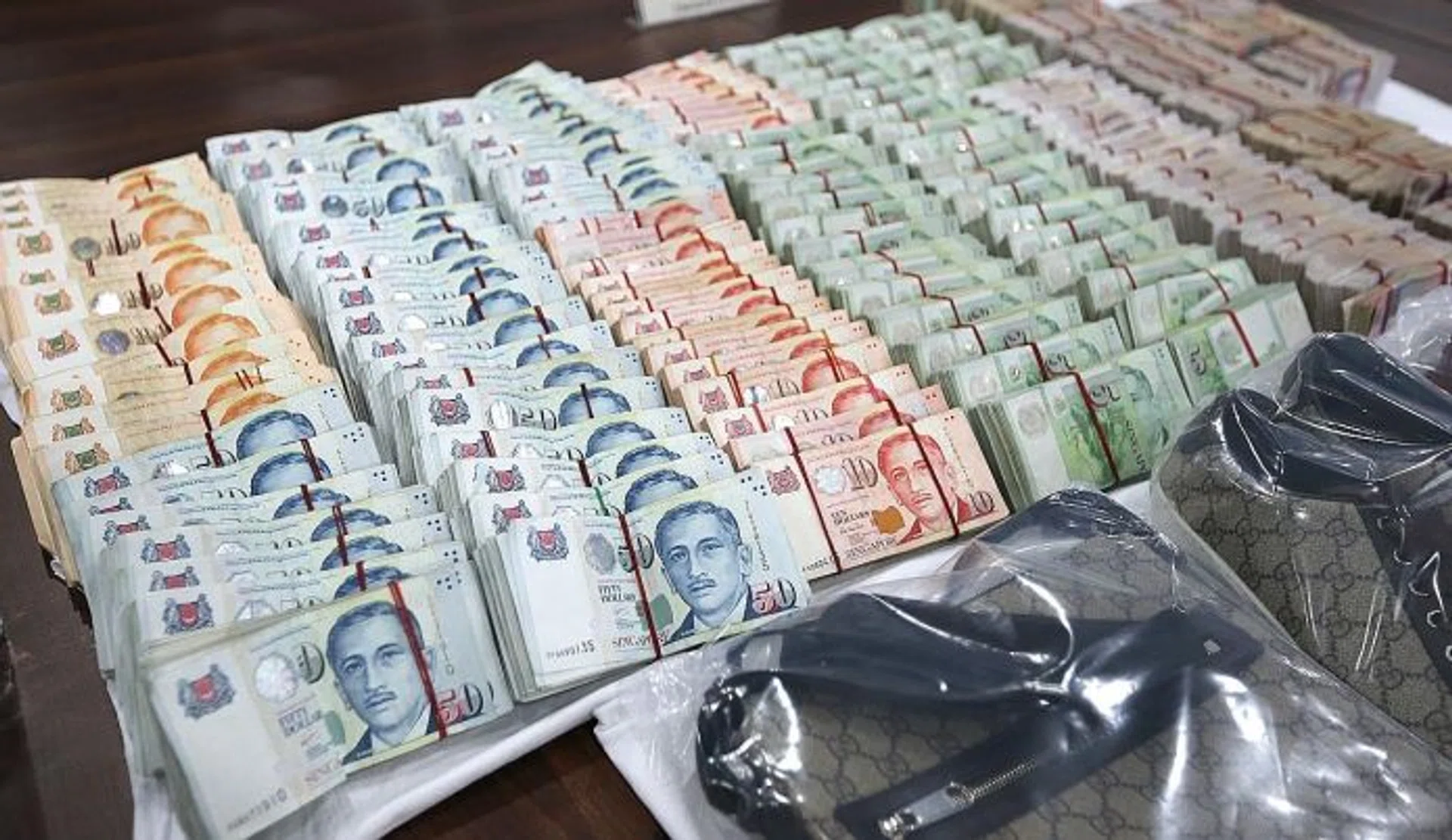 BRAZEN: Mr Loh Yong Soon's office, where robbers broke into his safe (by cutting out a hole the size of an A4-sized piece of paper to steal almost half a million in cash (above).
