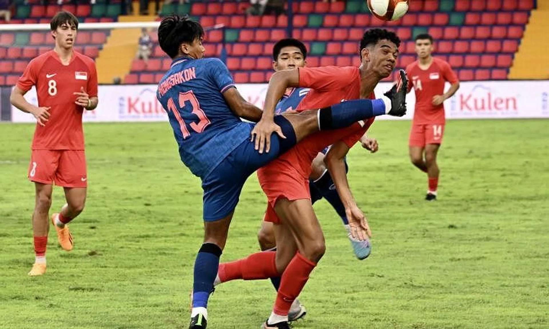 Singapore’s Jordan Emaviwe tussling for the ball with Thailand's Phongsakon Trisat against Thailand in Cambodia in 2023.