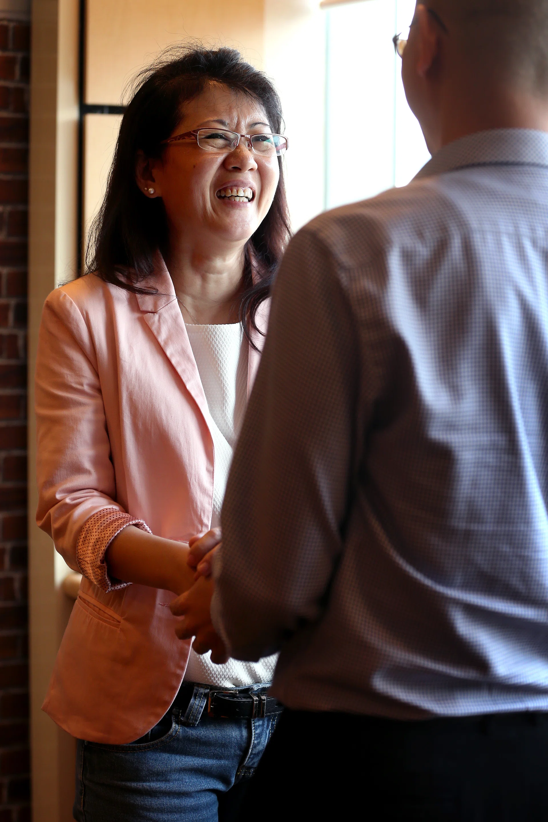 LIFELINE: Madam Michelle Lim meeting Mr Ken Gong for the first time yesterday since his cardiac 
arrest last month. 