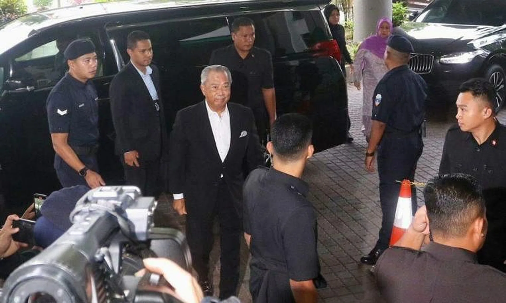 Mr Muhyiddin Yassin arrived at the Shah Alam Sessions Court where he is expected to be charged with money laundering.