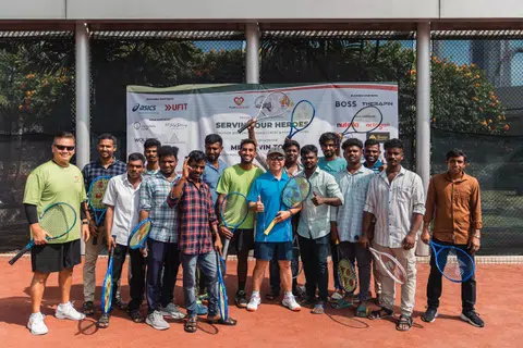 Shaheed Alam (foreground, centre), next to Law Minister Edwin Tong (right), exchanging volleys with migrant workers at the fund-raising tennis tournament.