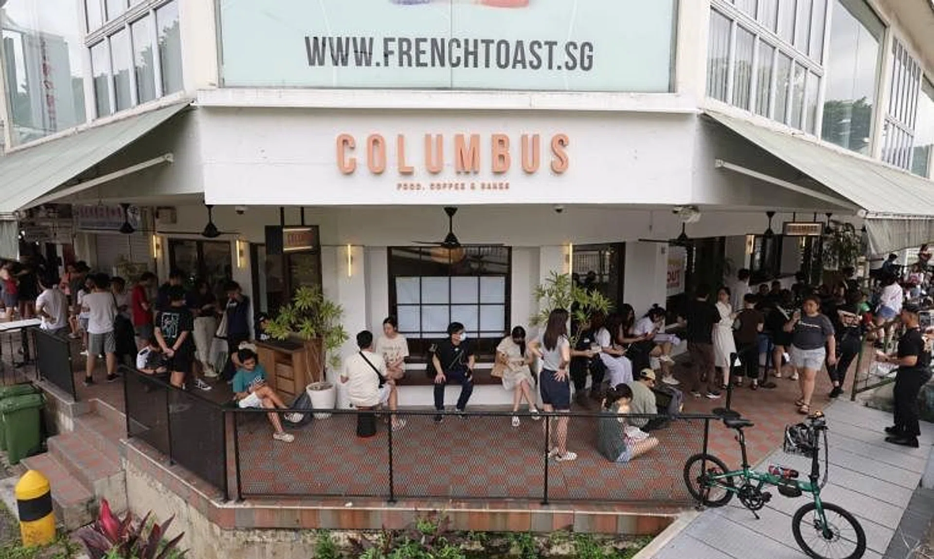 Customers wait in line at Columbus Coffee Company, at Upper Thomson, where the pop-up was held, on May 31.