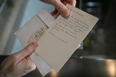 Mr Wayne Lee, 42, an in-flight customer service manager with Jetstar Asia, shows the note a passenger left for him.