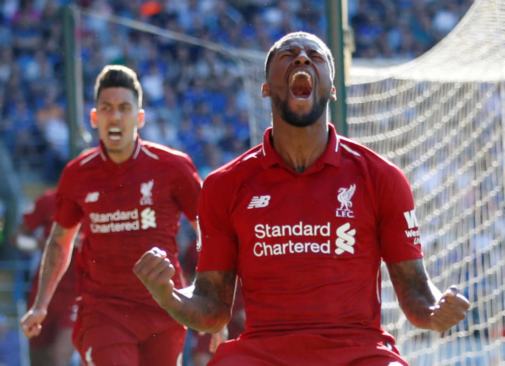 Georginio Wijnaldum lets out a roar after scoring Liverpool's first goal of a corner-kick routine.