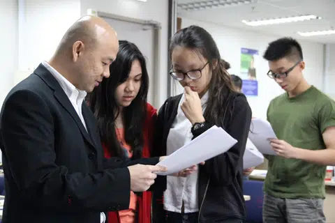 Mr Sean Chua, co-founder of Winners Education Centre, with his chemistry students.
