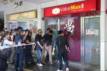 Manager grabbed 'bomb' and threw it out of store