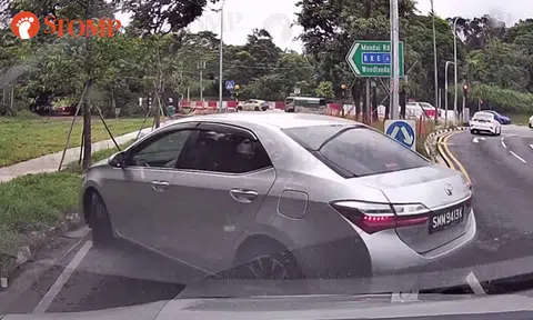 Driver blocks filter lane, force-reverses his way out